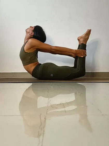 A deep Dhanurasana, or Bow Pose, to open the entire front of the body. This backbend is a fantastic heart opener and helps to relieve stress and fatigue by stimulating the entire posterior chain.