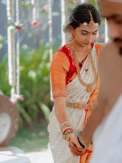 "Every ritual, a promise." This close-up shot focuses on the couple's hands during the ceremony, a symbol of their union and the promises they are making.