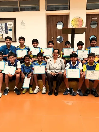 The camp concludes with a group of proud players holding their certificates alongside a faculty member. This image signifies the successful completion of our intensive High Performance Training Camp.