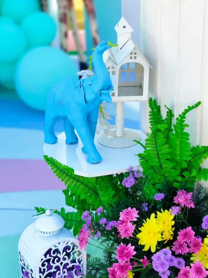 A close-up of the hand-painted elephant prop and other small details that add charm and character to the decor.