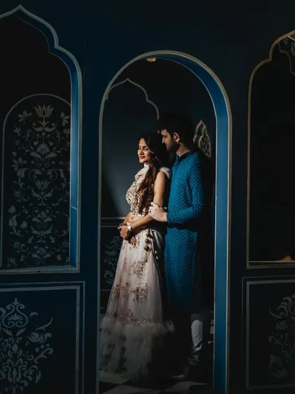 I love playing with light and shadow, as seen in this dramatic portrait inside a heritage property. The deep blue walls and the focused light create a moody, artistic image that feels both royal and intimate.
