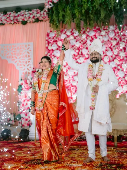 The couple's triumphant exit from the stage, complete with sparklers and cheers.