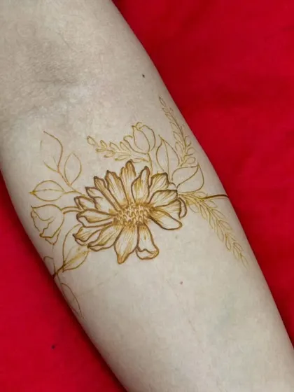 A delicate and simple floral sketch on the forearm, showing that mehndi can also be soft and subtle.