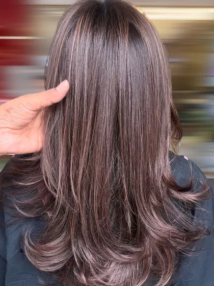 A closer look at the smokey mocha brown color, where you can see my hand blending the tones to create a seamless, natural effect.