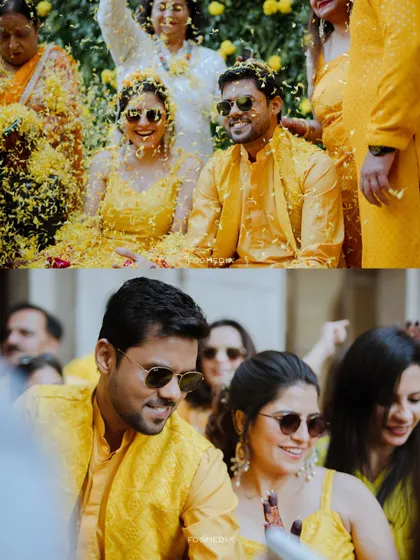 A shower of golden marigolds for the happy couple. This shot from a Kanpur Haldi ceremony shows the energy and fun that friends and family bring to the celebration.