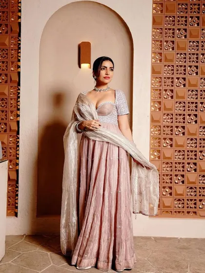Another stunning portrait of Navina, showcasing the sophisticated makeup and hair.