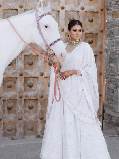 A modern-day princess arriving for her fairytale wedding. This bride's entry on a white horse was a statement of elegance and confidence.