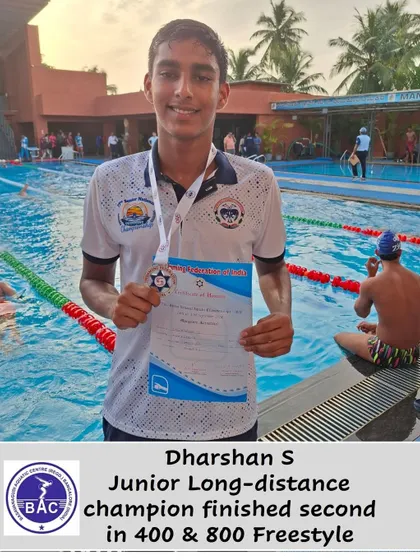 Dharshan S with his silver medals from the 400m & 800m Freestyle.