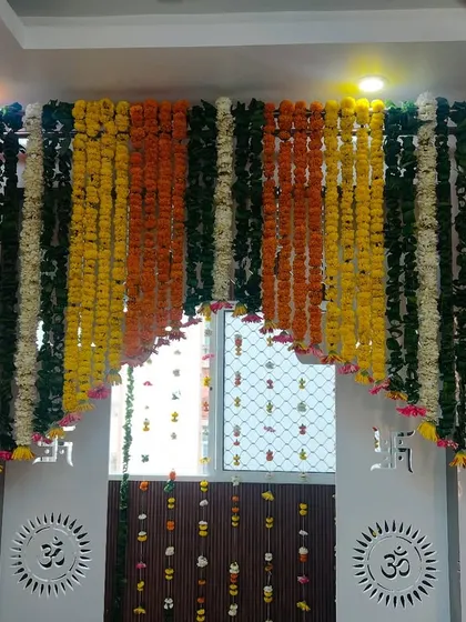 A beautiful curtain made entirely of marigold flower strings. This is a traditional and fragrant way to decorate an entrance for any auspicious occasion.