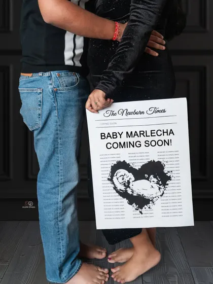 A creative close-up shot focusing on the "coming soon" announcement and the parents' feet. This is a unique and cute way to share your exciting news.