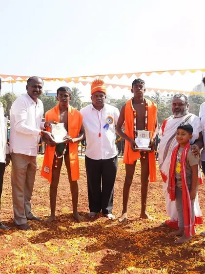 Presenting awards to the young winners of the traditional wrestling competition.
