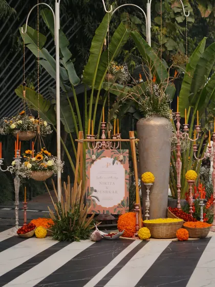 The entrance to a Haldi ceremony, with a personalized welcome sign and decor that sets a warm, inviting tone.