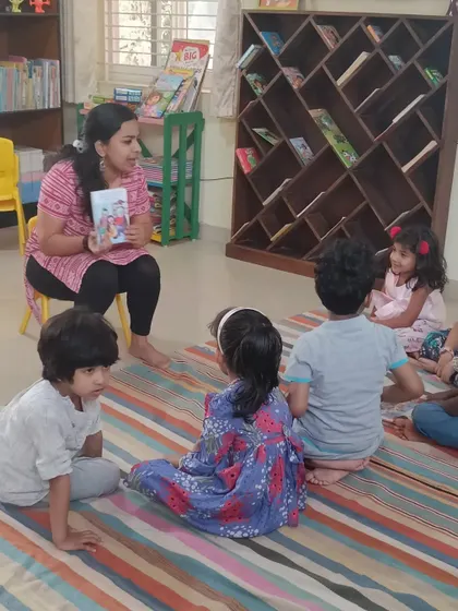 Children listen intently to a story, their expressions showing a mix of curiosity and excitement. We choose tales that teach important values like friendship, sharing, and good manners.
