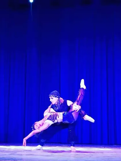 Performing a lift like this on stage is a powerful feeling that requires immense strength and coordination from both partners. This is an example of the advanced pas de deux work that is part of a professional ballet career.