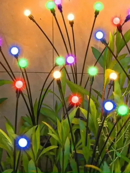 For a more festive look, these multi-colored firefly solar lights add a playful and vibrant touch to your garden.
