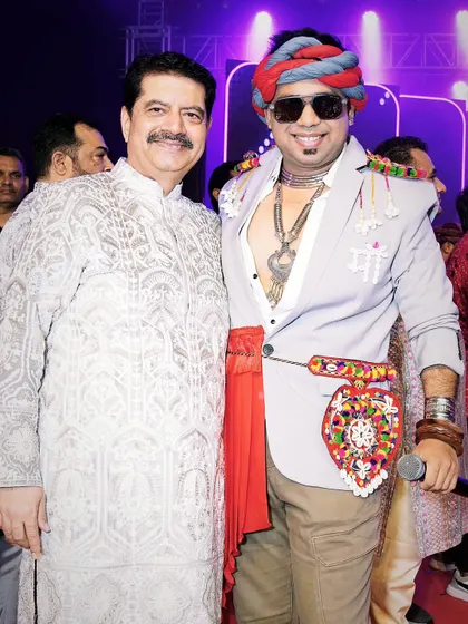 Sharing a moment with a respected guest at a Navratri event. I ensure that all VIPs and special guests feel welcomed and honored.