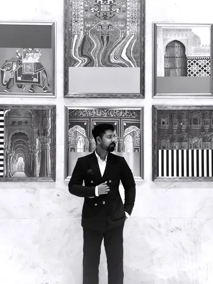 Posing in front of an art installation. I draw inspiration from all forms of art, which enriches my own creative process.