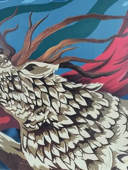 The right side of the Mysore mural, featuring a howling deer with flowing red fabric. This character complements the tiger, representing a different aspect of nature's spirit within the same epic composition.