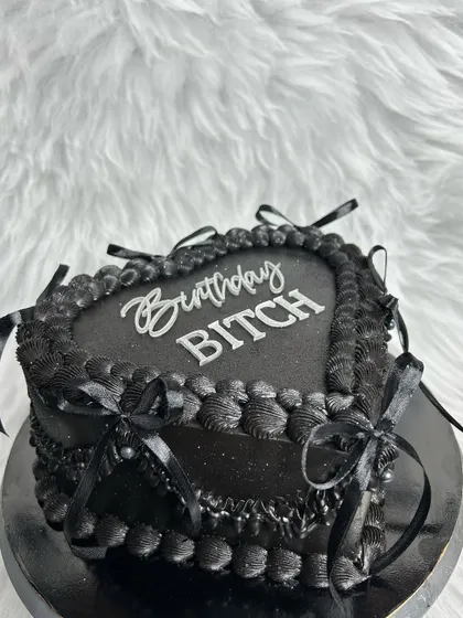 My team made this "Birthday Bitch" cake for my own birthday! A black heart-shaped vintage cake with silver lettering. They know me so well. It's the perfect mix of gothic and glam.