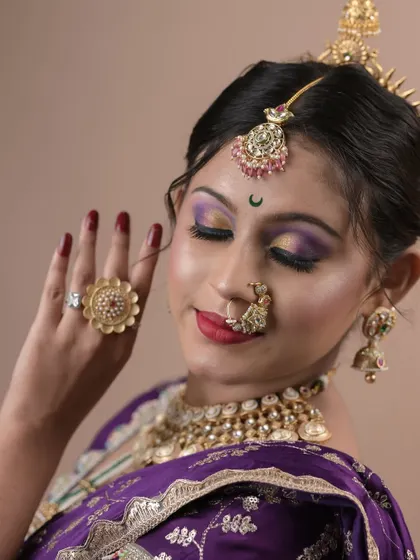 A close-up of the beautiful eye makeup and traditional jewelry from a student's final project.