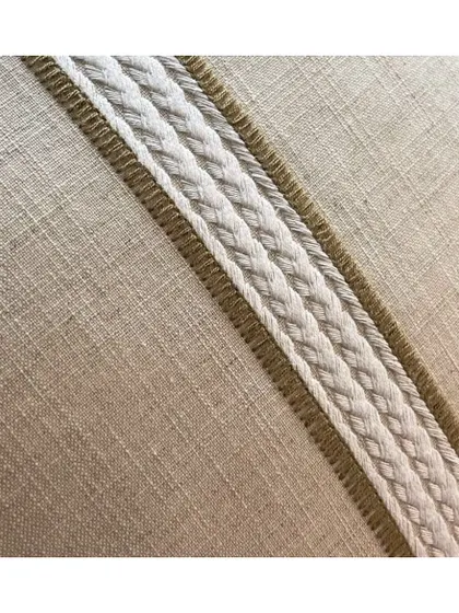 The 'OLIVIA' fabric, with its marled heavy thread and embroidered plaited stripes, is ideal for creating calm and zen spaces. Its natural texture makes it perfect for Roman blinds and curtains.