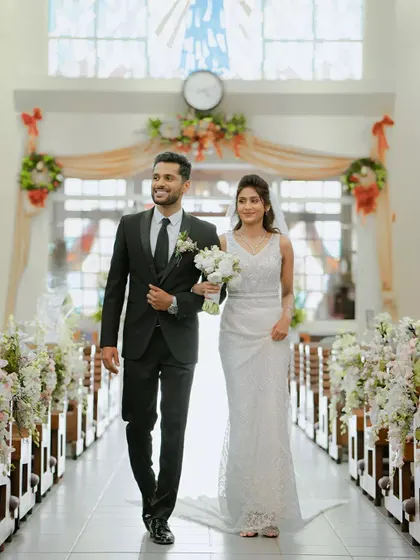 The triumphant walk down the aisle as husband and wife after a beautiful Christian church wedding. This shot captures the joy and promise of their new beginning.