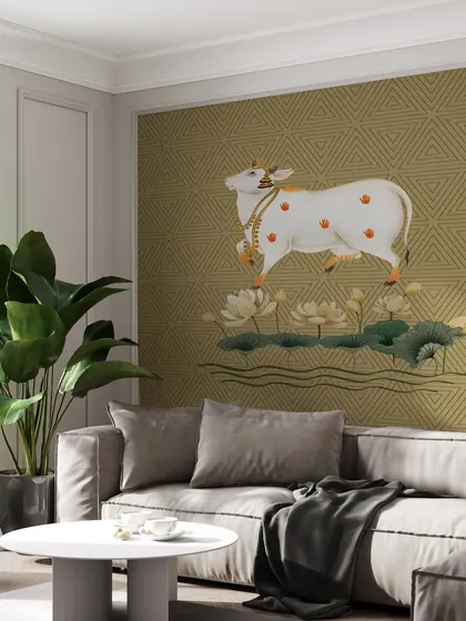 In this living room, the Sacred Indian Traditional Pichwai Cow wallpaper creates a serene and spiritual focal point. The earthy tones and sacred imagery promote a sense of calm and well-being.