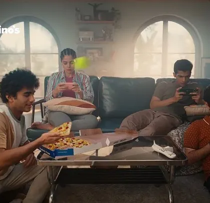 A scene from a Domino's ad showing friends enjoying pizza while gaming. I styled the cast in comfortable, casual outfits to create a relatable and authentic hangout scene.
