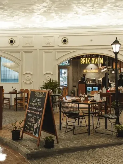 Our Palace Road location, designed to feel like a European street with its unique facade, cobblestone-style flooring, and lampposts.