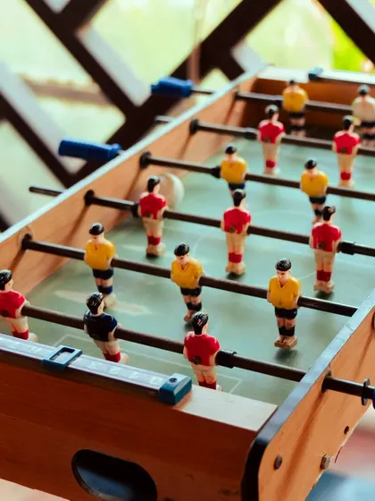 The foosball table is always a hub of energy and excitement, perfect for a quick and lively game.