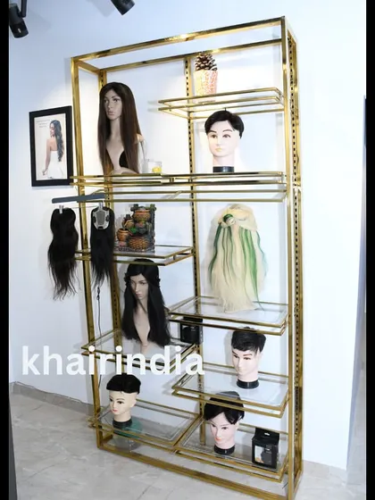 A full view of our new product display rack. It's filled with a wide range of options for both men and women, including different styles, colors, and types of hairpieces.