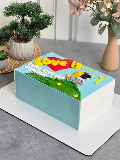 The "Love Is..." cake in a lifestyle setting, showing how it can be the centerpiece of a special celebration.