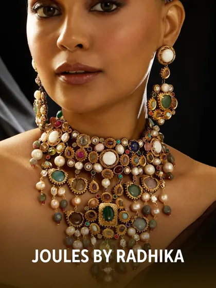 A close-up of the magnificent multi-gemstone necklace worn by Aneri Vajani, a true work of art.