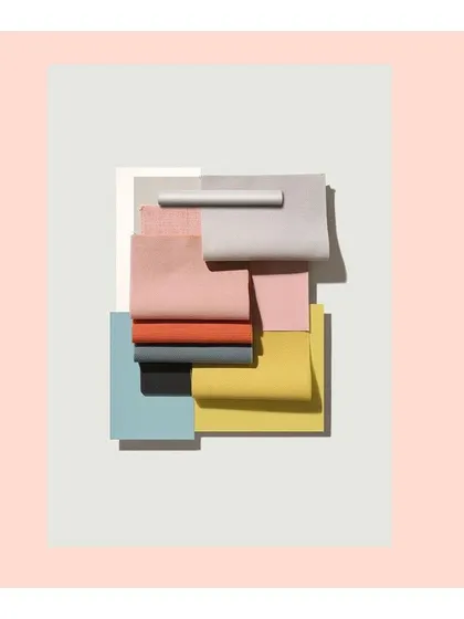 A playful arrangement of colorful fabric swatches, representing the vibrant and celebratory nature of the wedding and festive wear I create.