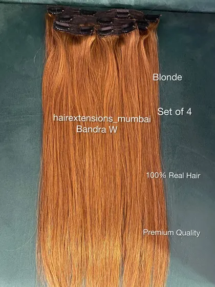 A set of 4 blonde clip-in extensions. These are perfect for adding highlights and volume to lighter hair shades.