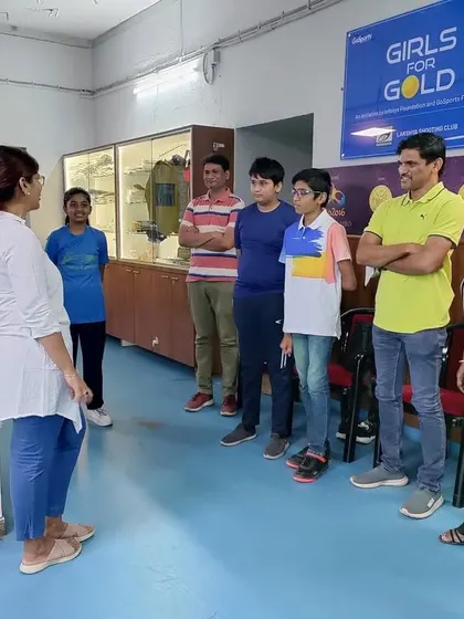 Suma Shirur giving tips to a group of campers and their parents. This direct interaction with an Olympian is a unique and motivating aspect of my program.