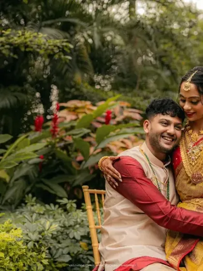 Nestled in a lush garden, the couple shares a warm, affectionate moment. I use natural surroundings to create a serene and romantic atmosphere for my portraits.