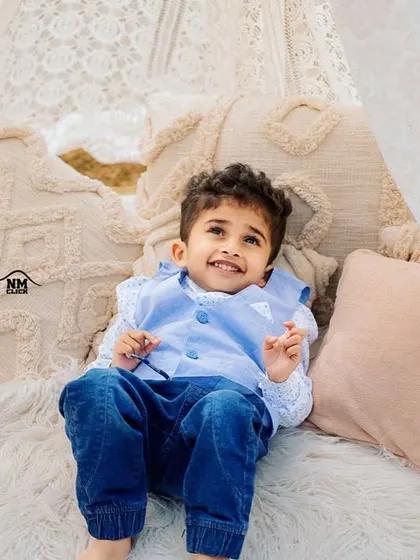 Happiness is looking up at the sky. This beautiful, bright portrait captures a moment of pure, simple joy.