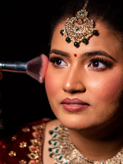 A closer look at the application of blush to create a healthy, rosy glow. I teach my students how to place blush perfectly to enhance the bride's features.