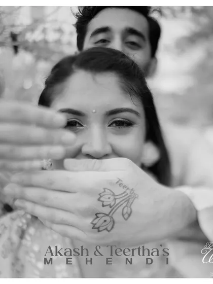 A playful and intimate Mehendi photo, capturing the couple's personality.