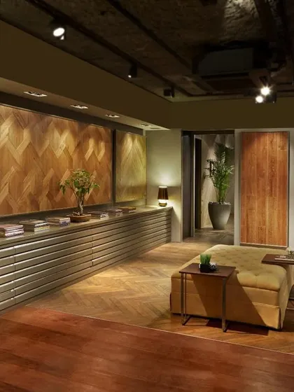This wood flooring showroom for FCML in Delhi was designed as an "experiential thoroughfare." We created unconventional display methods to showcase over 200 types of wood floors in a compact space, allowing clients to walk through and experience the materials in a gallery-like setting.