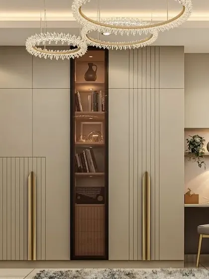 This wardrobe design incorporates a glass-front display section for books or decorative items. The combination of solid and glass doors, along with sleek metallic handles, creates a modern and versatile storage unit.