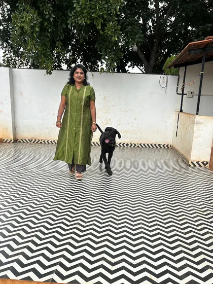 Taking a walk with a well-behaved black dog in our spacious play area.