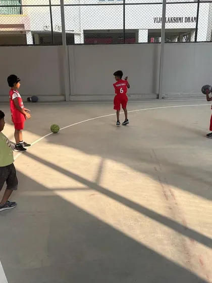 Kids practicing their passing skills, a crucial element of teamwork that we emphasize in our basketball coaching.
