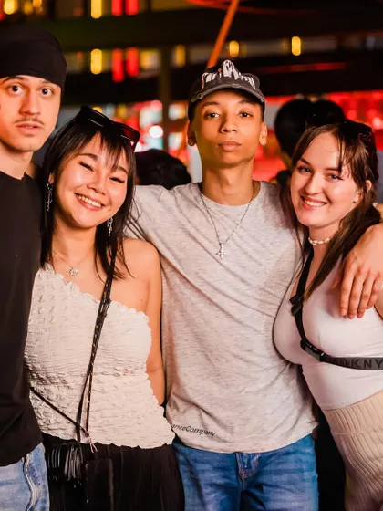 An international and diverse group of friends enjoying the music together.