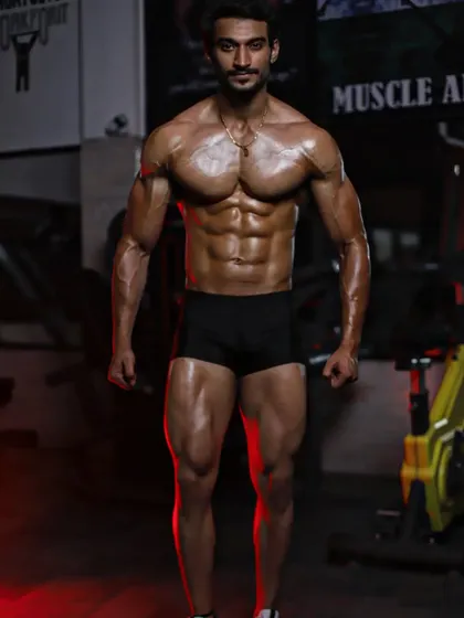 A full-body shot showcasing the results of my competition prep. This physique is built with a combination of heavy lifting and a precise nutrition plan.