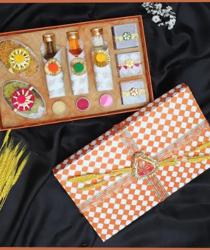 This compact Holi gift box is perfect for corporate giveaways. It includes small bottles of liquid colors, packets of gulal, and other festive essentials in a checkered-print box.