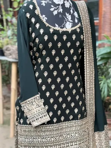The kurta has beautiful buti work all over, with a heavily embroidered neckline and sleeves.