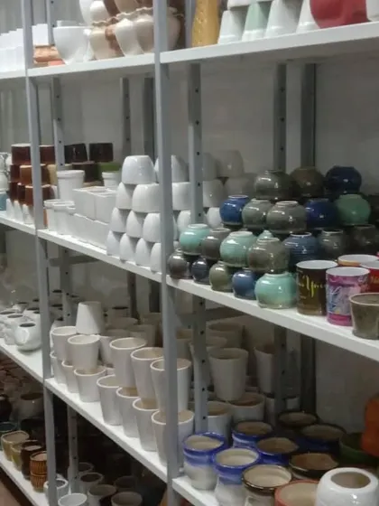 We offer a wide range of neutral-toned ceramic planters, including classic white cylinders and unique, artisanal glazed pots.