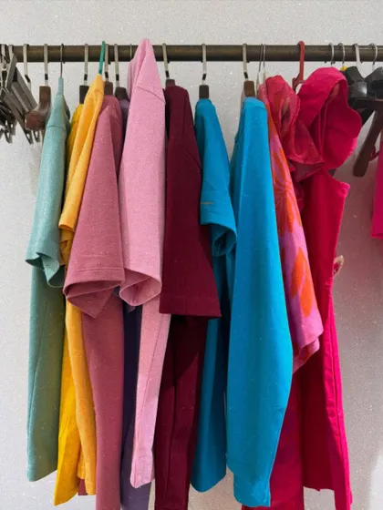 A behind-the-scenes look at the tools of my trade. This rack of colorful garments, organized and ready for a shoot, represents the preparation and palette that go into building a fashion story.